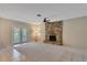 Large living room featuring a stone fireplace and double door exit at 403 Broadview Ave, Altamonte Springs, FL 32701