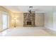 Bright living room with stone fireplace and tile flooring at 403 Broadview Ave, Altamonte Springs, FL 32701