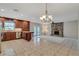 Living room with stone fireplace, open to kitchen and dining area at 403 Broadview Ave, Altamonte Springs, FL 32701