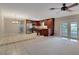 Open-concept living space with tile flooring adjacent to updated kitchen at 403 Broadview Ave, Altamonte Springs, FL 32701