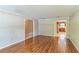 Open-concept living room with hardwood flooring, adjoined to other living spaces at 403 Broadview Ave, Altamonte Springs, FL 32701