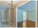 Inviting living room with gleaming hardwood floors and an archway to the adjoining rooms at 403 Broadview Ave, Altamonte Springs, FL 32701