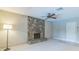 A spacious living room features a stone fireplace and ample natural light at 403 Broadview Ave, Altamonte Springs, FL 32701