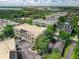 Wide aerial view capturing multiple buildings, parking areas, and lush surrounding greenery at 4385 Wardell Pl # 13, Orlando, FL 32814