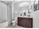 Functional bathroom featuring a single vanity with dark wood cabinetry and a shower-tub combination at 4385 Wardell Pl # 13, Orlando, FL 32814