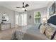 Bright bedroom with ample natural light, a ceiling fan, and access to a private balcony at 4385 Wardell Pl # 13, Orlando, FL 32814
