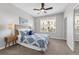 Bedroom with a queen-sized bed, large window, and bedside tables at 4385 Wardell Pl # 13, Orlando, FL 32814