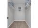 Walk-in closet featuring shelving and clothing rods at 4385 Wardell Pl # 13, Orlando, FL 32814