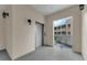 Hallway with elevator and open view of building exterior at 4385 Wardell Pl # 13, Orlando, FL 32814