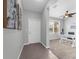 Inviting foyer with tiled flooring, a white front door, and an open view into the adjacent office space at 4385 Wardell Pl # 13, Orlando, FL 32814