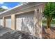 Spacious garage featuring classic white doors, offering convenient parking and storage solutions at 4385 Wardell Pl # 13, Orlando, FL 32814