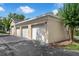 Detached garages featuring three bays and classic white doors for convenient parking and storage at 4385 Wardell Pl # 13, Orlando, FL 32814