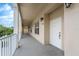 Long hallway with neutral colors, white doors, and multiple windows that provide natural light at 4385 Wardell Pl # 13, Orlando, FL 32814