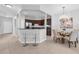 Open kitchen and dining area featuring stainless appliances, dark cabinets and a table set for dining at 4385 Wardell Pl # 13, Orlando, FL 32814
