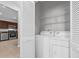 Bright laundry room with a full-size washer and dryer at 4385 Wardell Pl # 13, Orlando, FL 32814