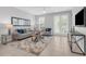 Bright living room with neutral decor, comfortable seating, and access to outdoor views at 4385 Wardell Pl # 13, Orlando, FL 32814