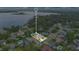 Aerial view of a lovely home with a screened pool in a neighborhood with easy access to a serene lake at 4390 Carolwood St, Orlando, FL 32812