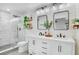 Modern bathroom with double vanity, walk-in glass shower, and stylish fixtures at 4390 Carolwood St, Orlando, FL 32812