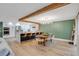Open dining area with modern lighting, seating for six, and seamless access to the kitchen at 4390 Carolwood St, Orlando, FL 32812