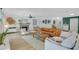 Comfortable living room featuring a fireplace, wood-look floors, and stylish furnishings at 4390 Carolwood St, Orlando, FL 32812
