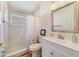 Neutral bathroom features walk-in shower, framed mirror, and white vanity for a relaxing atmosphere at 4533 Oakbrook Ct, Kissimmee, FL 34746
