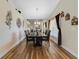Formal dining room with hardwood floors and a large window at 4533 Oakbrook Ct, Kissimmee, FL 34746