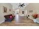 Bright living room boasts wood flooring, neutral walls, and plenty of space to relax and entertain at 4533 Oakbrook Ct, Kissimmee, FL 34746