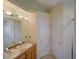 Bathroom featuring double sinks with a shower at 456 Old Bridge Cir, Davenport, FL 33897