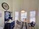 Cozy breakfast nook featuring a coffee bar, ample natural light, and views of the pool, perfect for morning coffee at 456 Old Bridge Cir, Davenport, FL 33897