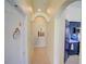 Hallway with decorative nooks leading to the kitchen at 456 Old Bridge Cir, Davenport, FL 33897