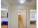 Hallway view showing entrances to two bedrooms and a bathroom at 456 Old Bridge Cir, Davenport, FL 33897