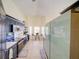 Open kitchen view with navy cabinets, stainless appliances, eat-in kitchen and lots of natural light at 456 Old Bridge Cir, Davenport, FL 33897