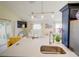 The kitchen sink overlooks the living room with an open floor plan and abundant natural light at 456 Old Bridge Cir, Davenport, FL 33897