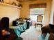 Cozy bedroom with neutral walls, window, plush carpet, and a comfortable daybed at 46 Carriage Hill Cir, Casselberry, FL 32707