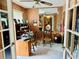 Home office with desk, French doors, and a window for natural light at 46 Carriage Hill Cir, Casselberry, FL 32707