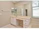 Large bathroom vanity with ample counter space, cabinets, drawers, a large mirror, and a bathtub at 492 Lanarkshire Pl, Apopka, FL 32712