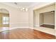 Elegant dining room showcasing hardwood floors, chandelier lighting, and archway entrances at 492 Lanarkshire Pl, Apopka, FL 32712