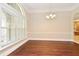 Elegant dining room featuring hardwood floors, crown molding, and abundant natural light at 492 Lanarkshire Pl, Apopka, FL 32712