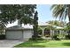 Charming single-story home with a well-manicured lawn and a spacious three-car garage at 492 Lanarkshire Pl, Apopka, FL 32712