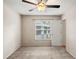 Bedroom with neutral walls, ceiling fan and window offering natural light at 507 Northlake Dr # 507, Sanford, FL 32773