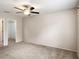 Spacious bedroom featuring plush carpeting, neutral paint and a ceiling fan at 507 Northlake Dr # 507, Sanford, FL 32773