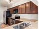 Well-lit kitchen featuring stainless steel appliances and granite countertops at 507 Northlake Dr # 507, Sanford, FL 32773