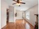 Spacious living room with fireplace, hardwood floors, and doorways leading to other rooms in the home at 507 Northlake Dr # 507, Sanford, FL 32773
