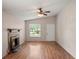 Inviting living room with a cozy fireplace, wood floors, and a ceiling fan for added comfort at 507 Northlake Dr # 507, Sanford, FL 32773