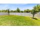 Lush backyard with neatly cut lawn and tall privacy fence at 5677 Cedar Chase Dr, St Cloud, FL 34771