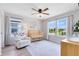 Charming Bedroom with a crib, a cozy armchair, and natural light, creating a warm and inviting space at 5677 Cedar Chase Dr, St Cloud, FL 34771