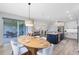 Open dining area with backyard views, seamlessly connecting indoor and outdoor living spaces at 5677 Cedar Chase Dr, St Cloud, FL 34771