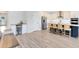 Bright, modern kitchen with stainless steel appliances and breakfast bar seating four at 5677 Cedar Chase Dr, St Cloud, FL 34771