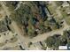 Aerial view of a large, wooded lot surrounded by streets, with a red boundary line marking the property at 578 3Rd St, Daytona Beach, FL 32117