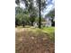 Expansive backyard with mature trees offering shade and privacy for outdoor enjoyment at 578 3Rd St, Daytona Beach, FL 32117